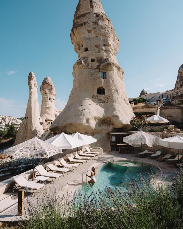 The pool at Aza Cave Hotel beneath a fairy chimney in Göreme