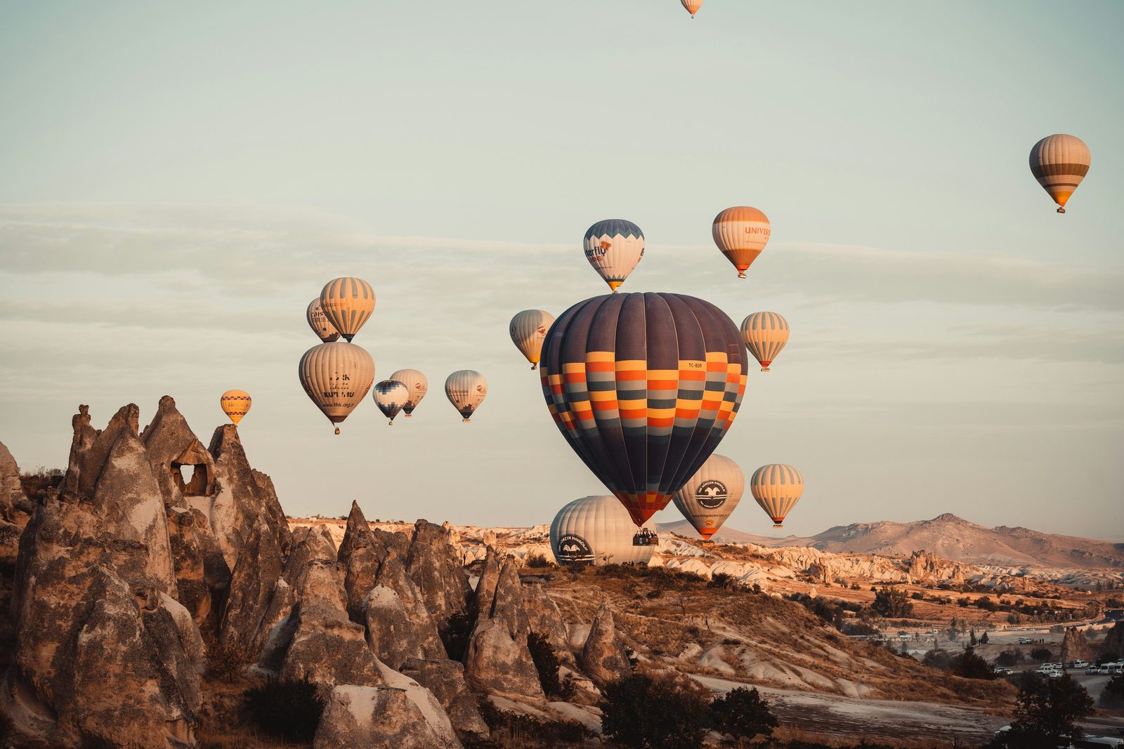 Hot air balloons over the Cappadocia valleys at sunrise