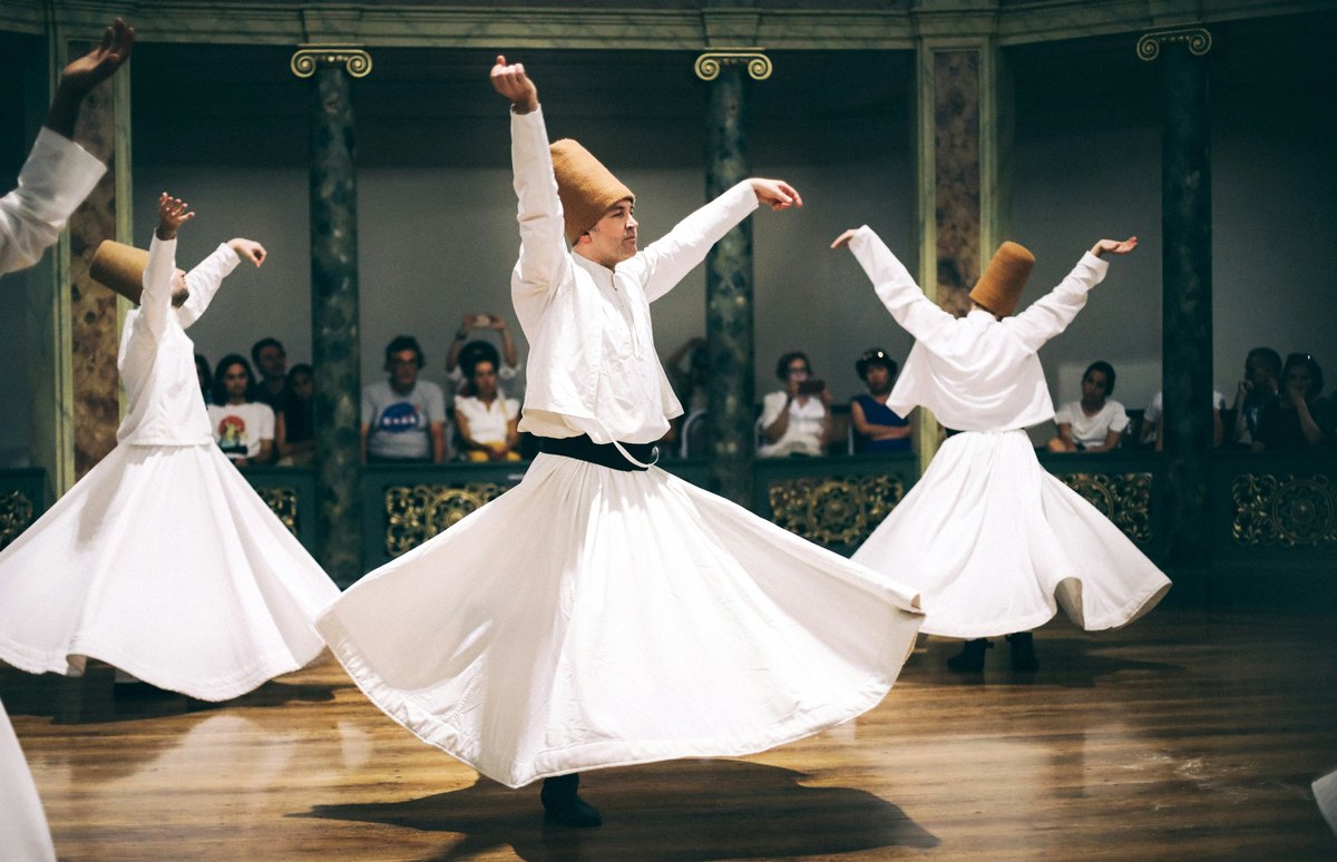 Whirling dervishes performing the sema ceremony